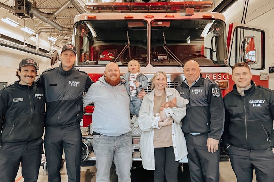 Martyka Sutor, her partner Steven, son Arlo and newborn daughter Maia pose for a photo with firefighters from Surrey’s Hall 17. (Contributed photo)