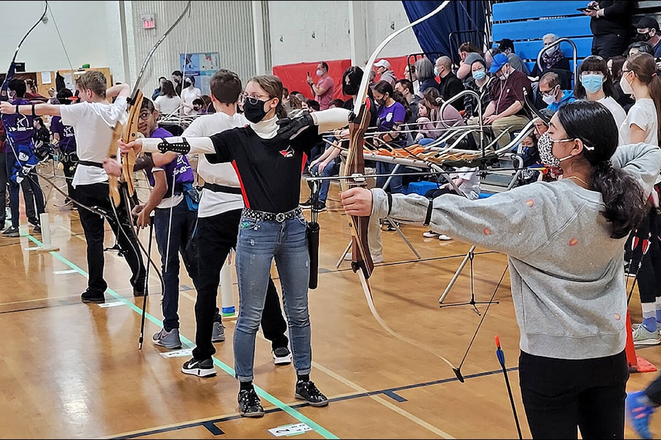 Maple Ridge archers Meaghan Durupt (middle, in black), and Aaliya Tyagi (right) compete for a provincial championship. (Neil Corbett/The News)