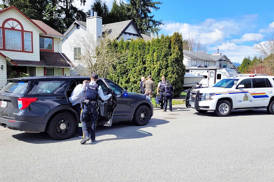 A man is taken into custody by police. (Neil Corbett/The News)