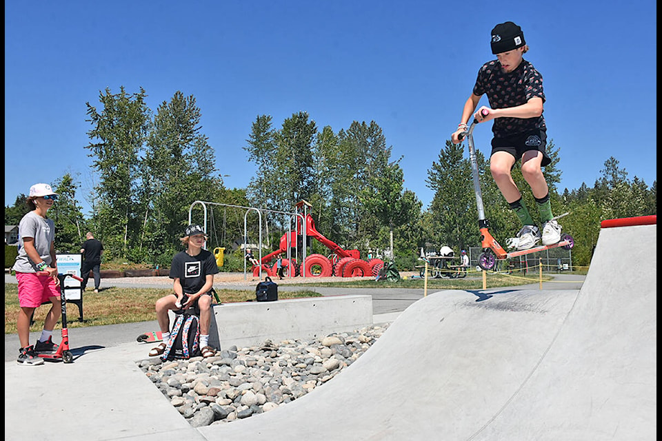 Chase Vossenaar (right) is getting his tricks down at the new skateboard feature. (Neil Corbett/The News)