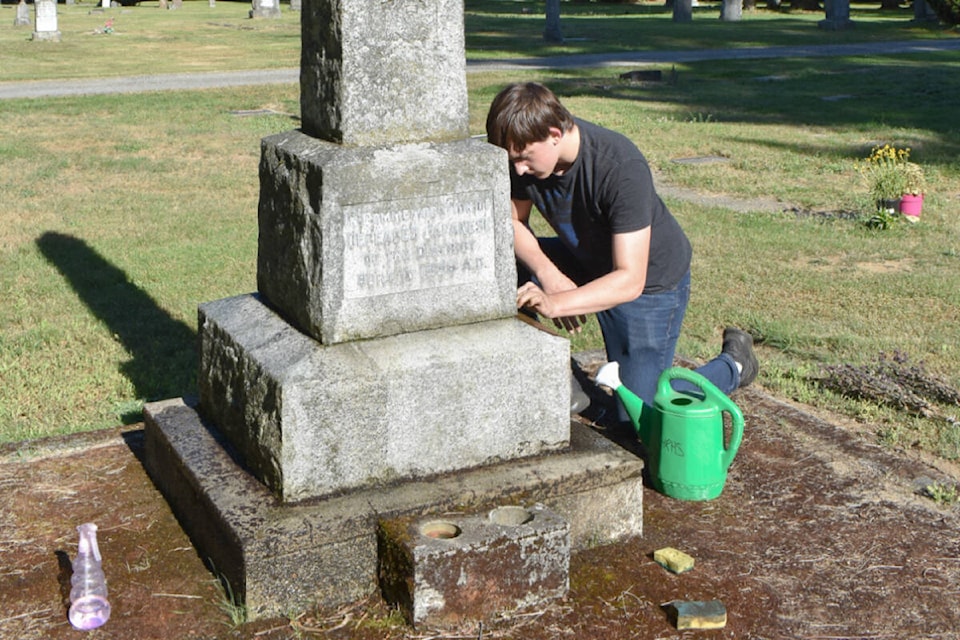 A team of volunteers recently scoured clean some of the older gravestones at Maple Ridge Cemetery, and another working bee is planned for next month. Abby Lizee, Maple Ridge Museum/Special to The News)