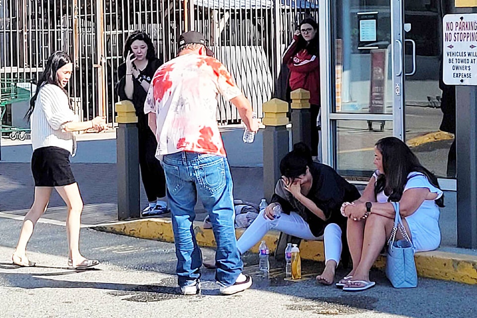 Victims are treated outside ValleyFair Mall after a foiled robbery of a jewelry store. (Neil Corbett/The News)