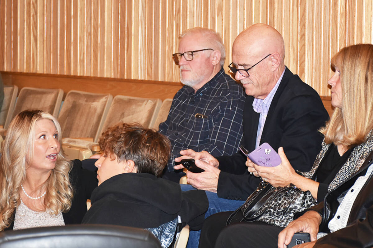 Incumbent mayoral candidate Mike Morden, centre, with members of his Maple Ridge First slate, watches the election results come in Saturday night, Oct. 15. (Neil Corbett/The News)