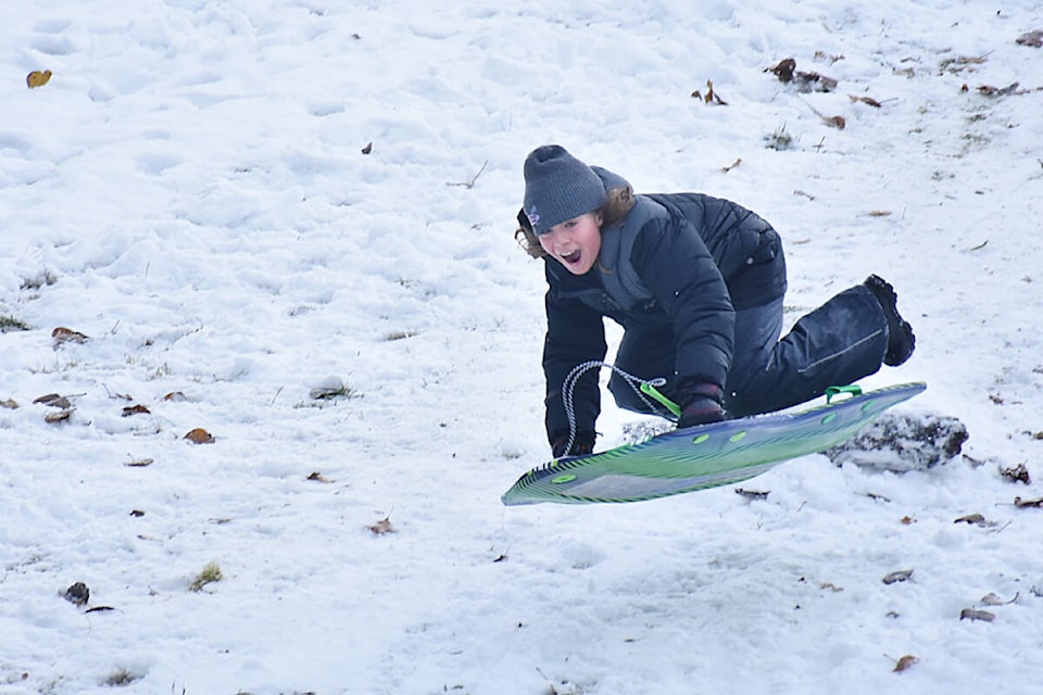 Liam O’Connor, 11, flies off a snow ramp at Harry Hooge Park Wednesday morning. (Colleen Flanagan/The News)