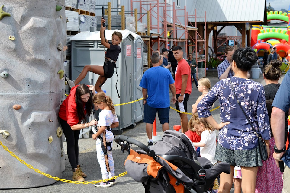 The first annual Haney Block Party included rock climbing, an inflatable obstacle course, and many other family-friendly activities. (Brandon Tucker/The News)