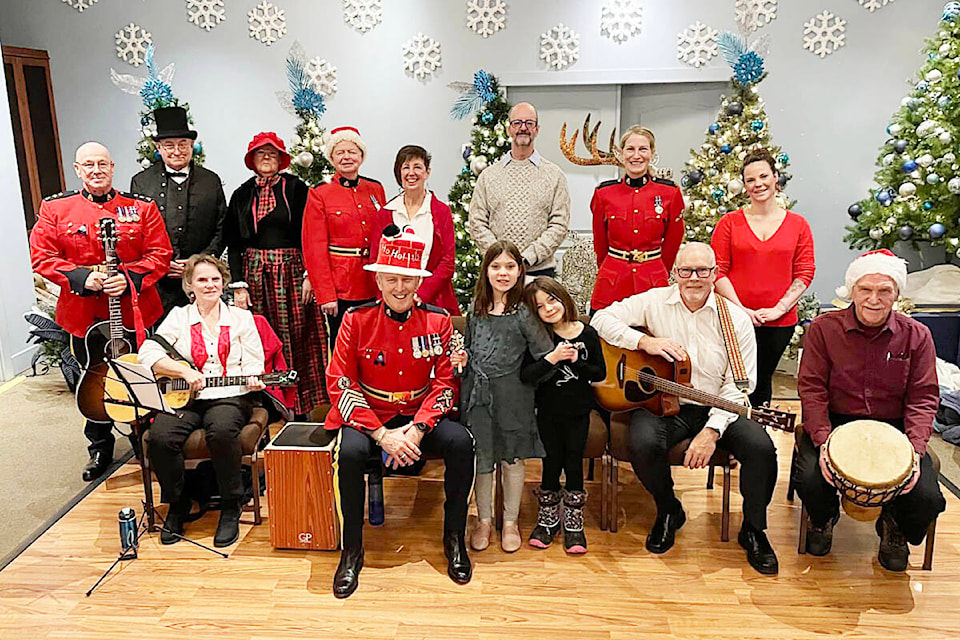 Regular RCMP members, retired members, volunteers, a guitar group and other community members, performed for seniors in Maple Ridge on Christmas Day. (Dave Walsh/Special to The News)