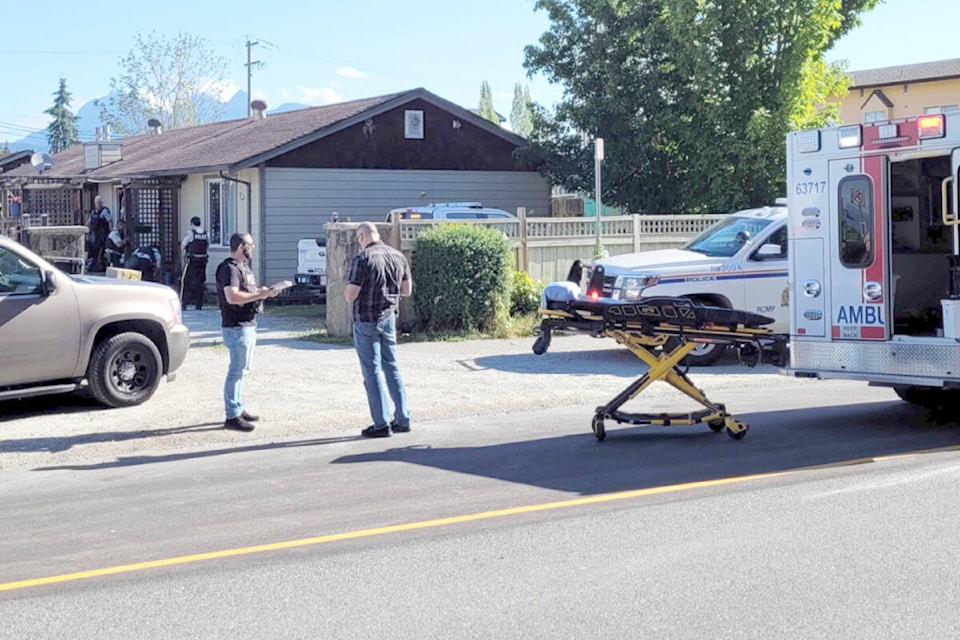 Police and paramedics on the scene of a fatal shooting on July 15. (The News files)