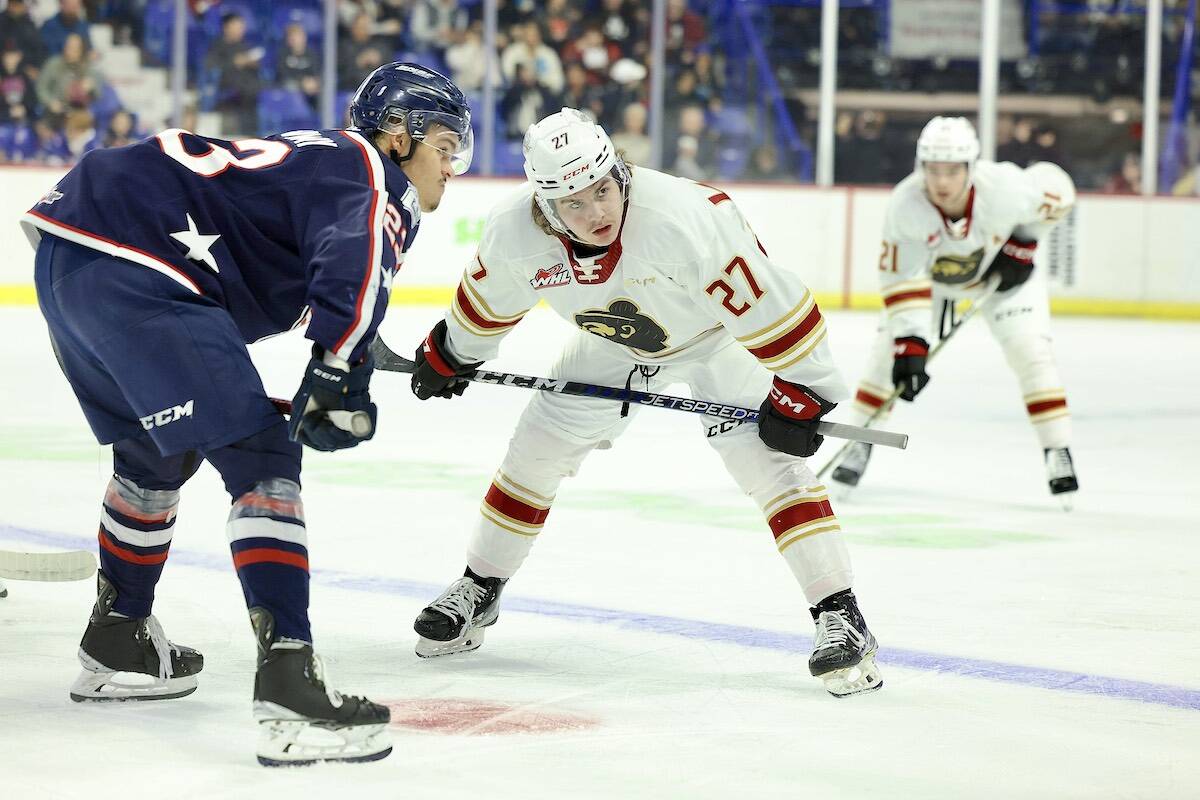 Kyren Gronick faced off against a Tri-City player with Dylan Anderson awaiting the outcome Sunday afternoon, Jan. 15 at Langley Events Centre. Gronick got the Giants on the board at 6:14 into the third period, assisted by Ethan Semeniuk and Anderson. (Rob Wilton/Special to Langley Advance Times)