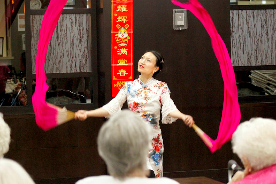 Jessica Yue is a professional dancer who taught residents of Revera Sunwood seniors care home in Maple Ridge about Lunar New Year and demonstrated several traditional Chinese dances on Jan. 21, 2023. (Brandon Tucker/The News)
