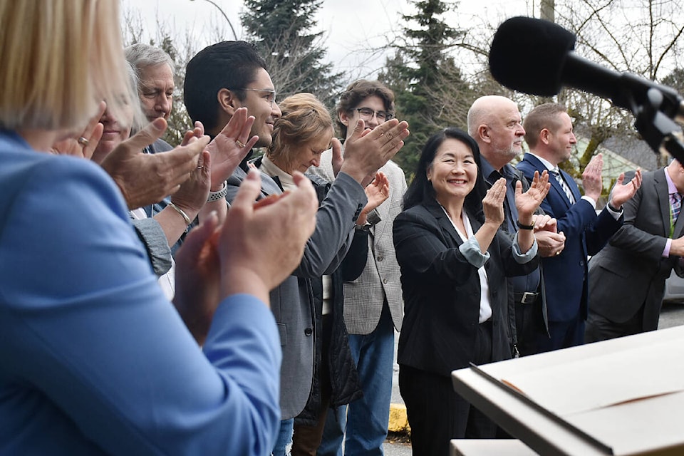 School board chair Elaine Yamamoto claps after a funding announcement by the province for a new school to replace Pitt Meadows Secondary. (Colleen Flanagan/The News)
