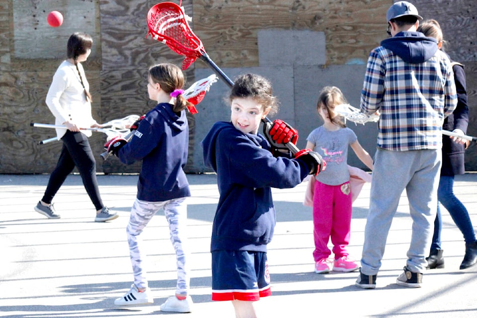 About 20 girls showed up for the first free girls lacrosse session hosted by the Ridge Meadows Minor Lacrosse Association on Saturday, March 18. (Brandon Tucker/The News)