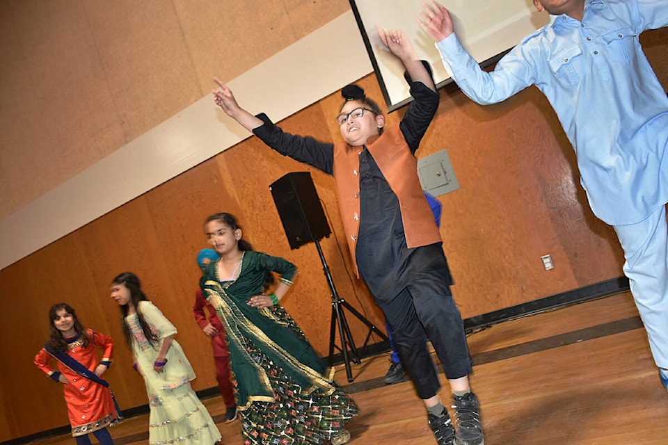Fatehjit Mand, Grade 4, jumps in the air during a bhangra dance demonstration for Vaisakhi. (Colleen Flanagan/The News)