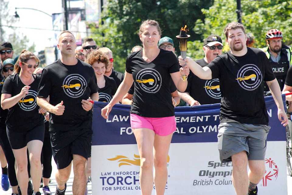 Ridge Meadows RCMP members, Special Olympians, local dignitaries, and community members participated in the 2023 Law Enforcement Torch Run in Maple Ridge on June 1. (Brandon Tucker/The News)