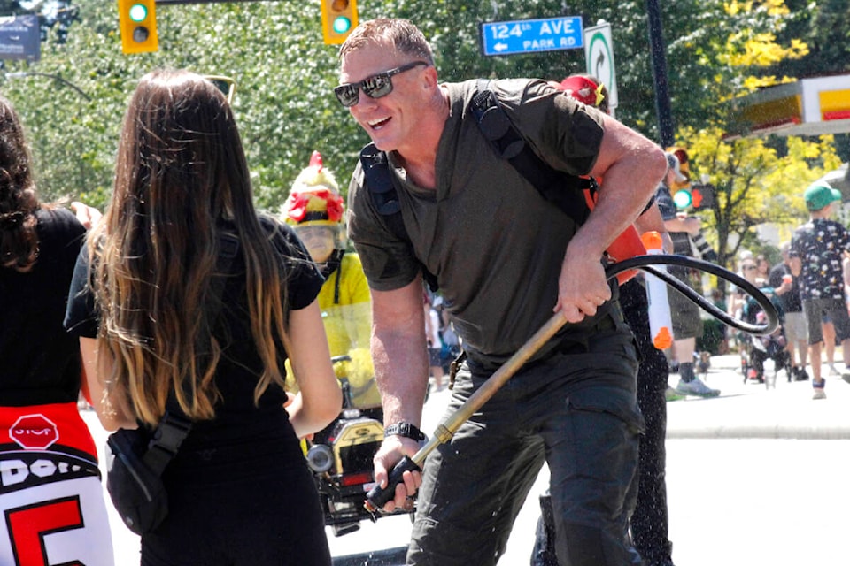 Pitt Meadows firefighters participated in the Pitt Meadows Day parade on June 3 and engaged in a water fight with spectators. (Brandon Tucker/The News)