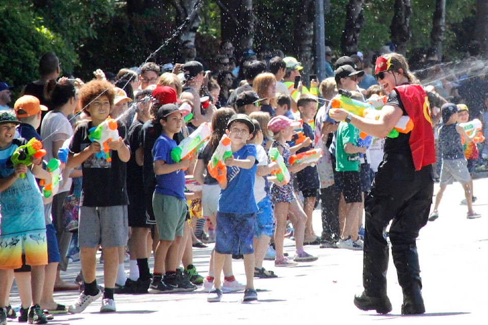 Pitt Meadows firefighters participated in the Pitt Meadows Day parade on June 3 and engaged in a water fight with spectators. (Brandon Tucker/The News)