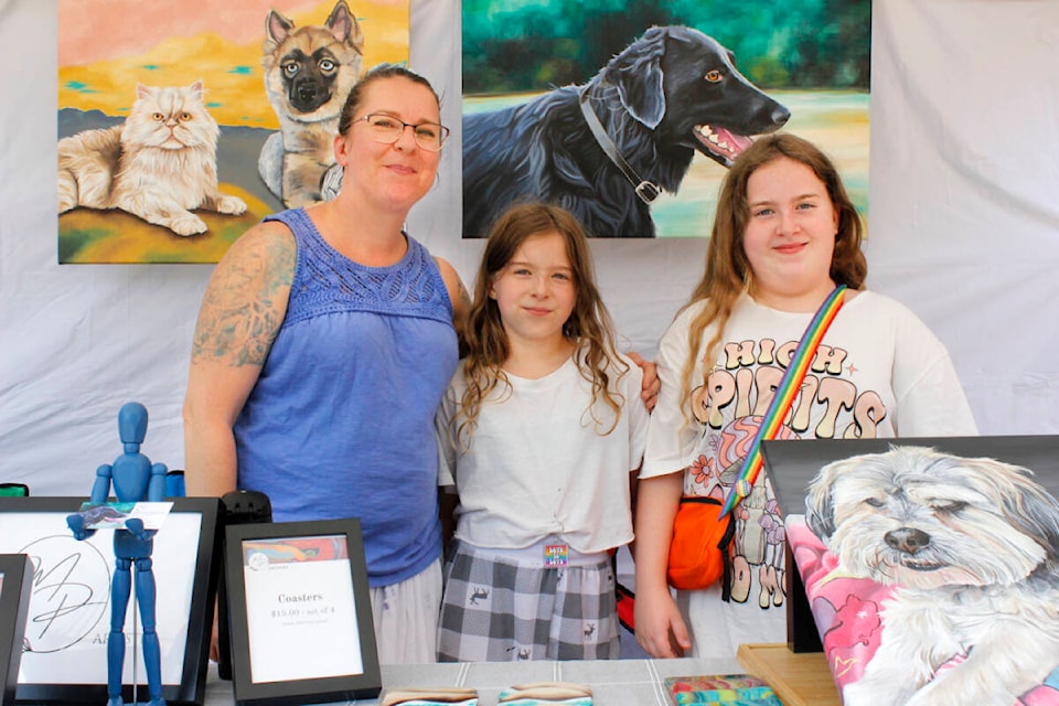 Miranda Pylypiuk (left) was one of several local artists who participated in the Aug. 26 Artists in the Park event at Memorial Peace Park. (Brandon Tucker/The News)