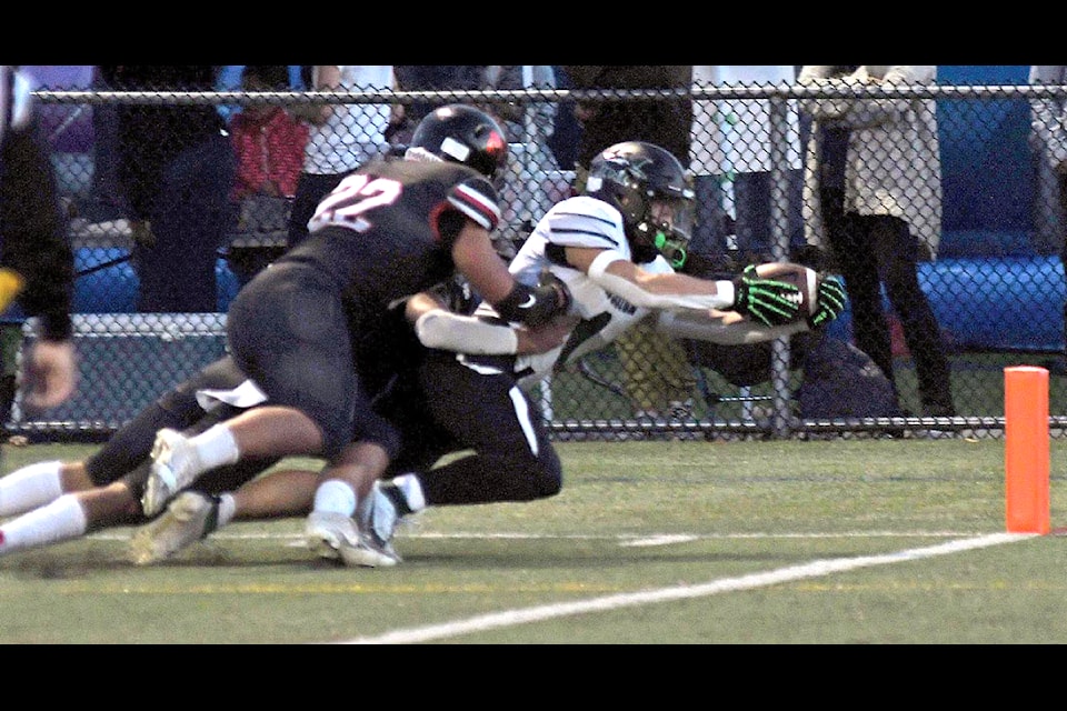 Mission running back Jaxson Tennant extends to reach the end zone. 