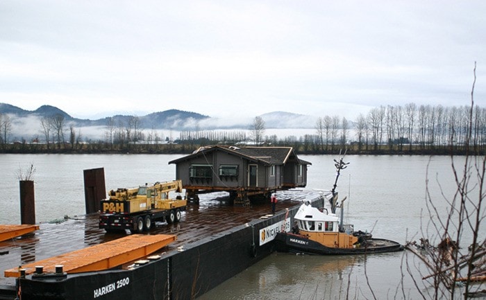 A panabode house was brought to Mission on the Fraser River Thursday morning.