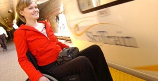 64927surreywoman_in_wheelchair_on_skytrain