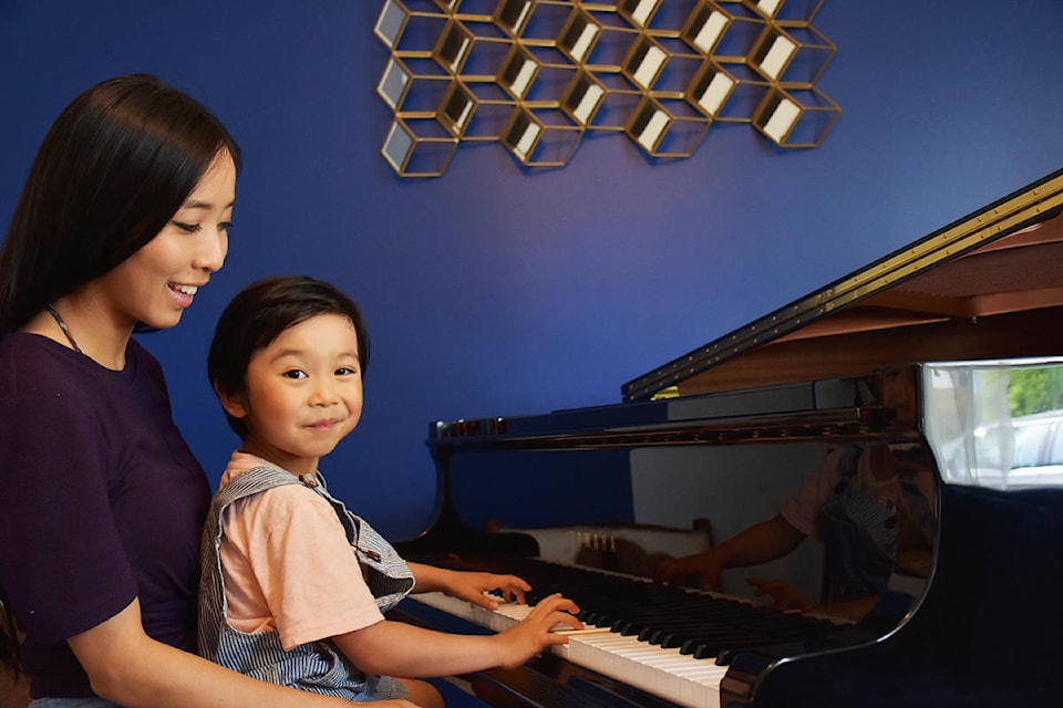 Lucas Yao and his mom, Cindy, sitting at the family’s grand piano. (Ronan O’Doherty/ THE NEWS)