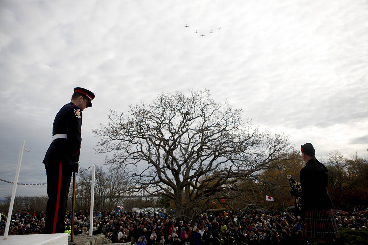 Planes fly in formation above a large crowd who gathered to honour the fallen during a Remembrance Day ceremony at the War Memorial in Oak Bay, B.C., on Monday, November 11, 2019. THE CANADIAN PRESS/Chad Hipolito