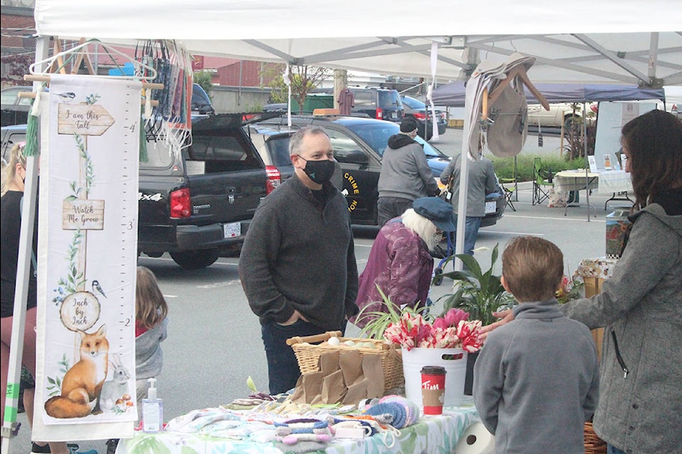Mission-Maple Ridge MLA Bob D’Eith speaks to one of the vendors at the 25th opening of Mission’s Farmers Market on May 1. / Patrick Penner Photo