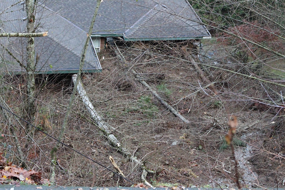 Logs have crashed through windows, and a significant amount of mud has entered the home. Patrick Penner / Mission Record.