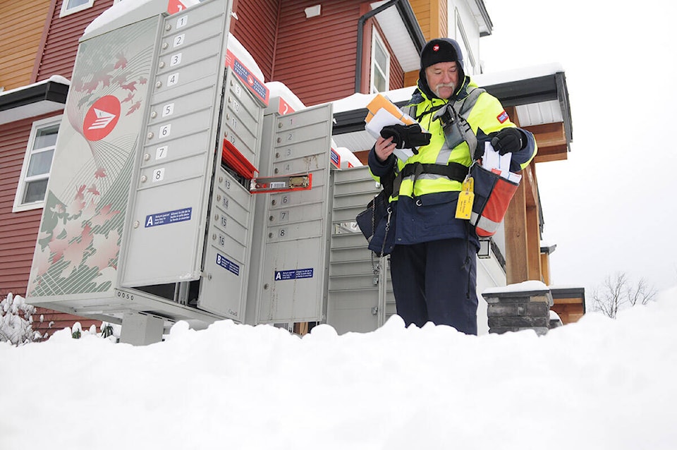 27755606_web1_220107-CPL-CanadaPost-delivery-delayed-freezingrain-Canada-Post-Carrier_1