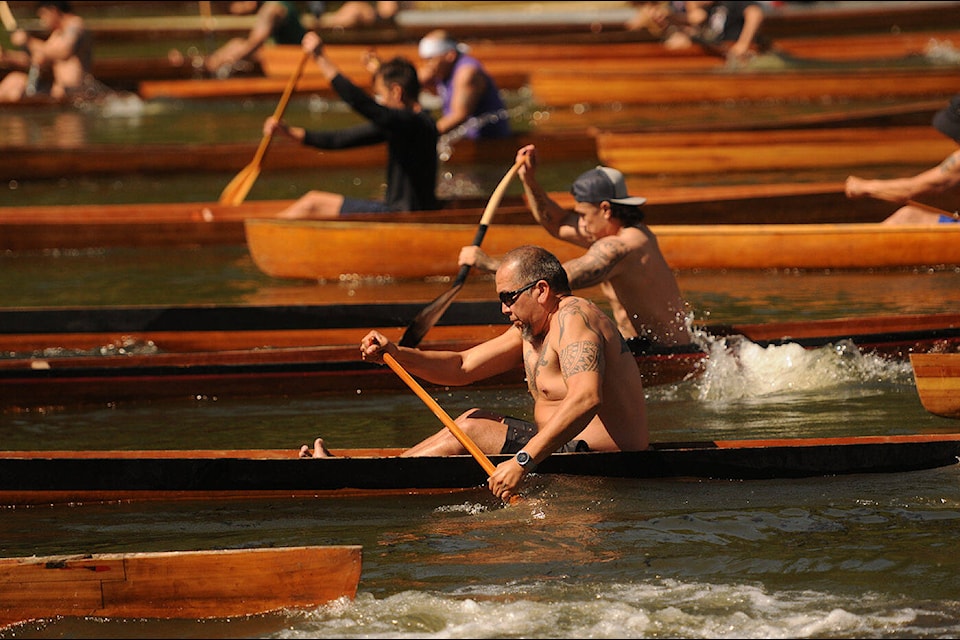 Paddlers take part in the 2022 River Spirit Canoe Races at Chilliwack Landing on Skwah First Nation on Saturday, May 21, 2022. (Jenna Hauck/ Chilliwack Progress)