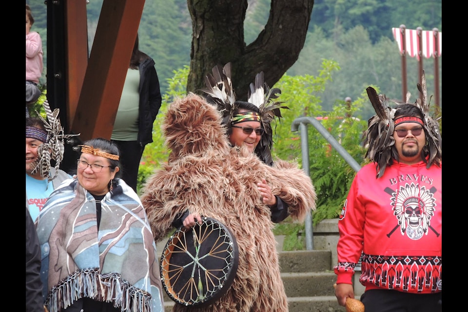 Sasquatch embraces Sts’ailes Chief Ralph Leon during the opening ceremonies of Sasquatch Days on Saturday, June 18. (Adam Louis/Observer)