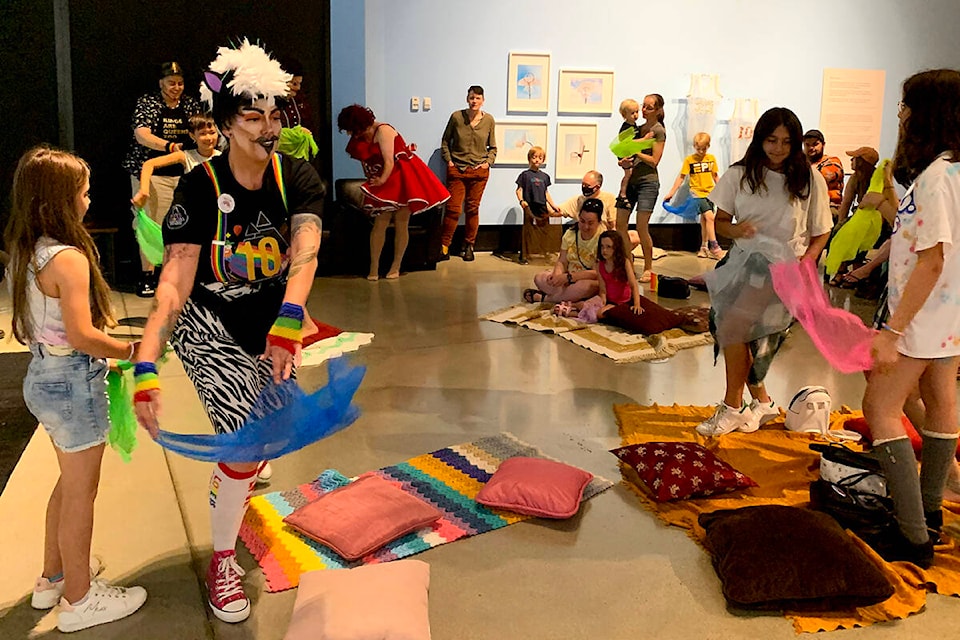 Armand Hammer got the kids up and moving with some dancing before settling in to read a story about a child learning to accept he can have two dads, at The Reach Art Gallery in Abbotsford on July 12. (Jessica Peters/Abbotsford News)