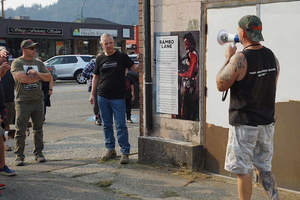 A ‘Rambo Lane’ sign is unveiled at an alley where it meets 3rd Avenue in Hope on Friday, Oct. 7, 2022. This was part of a walking tour on the first day of the Rambo First Blood 40th Anniversary celebrations. (Bill Dobbs)