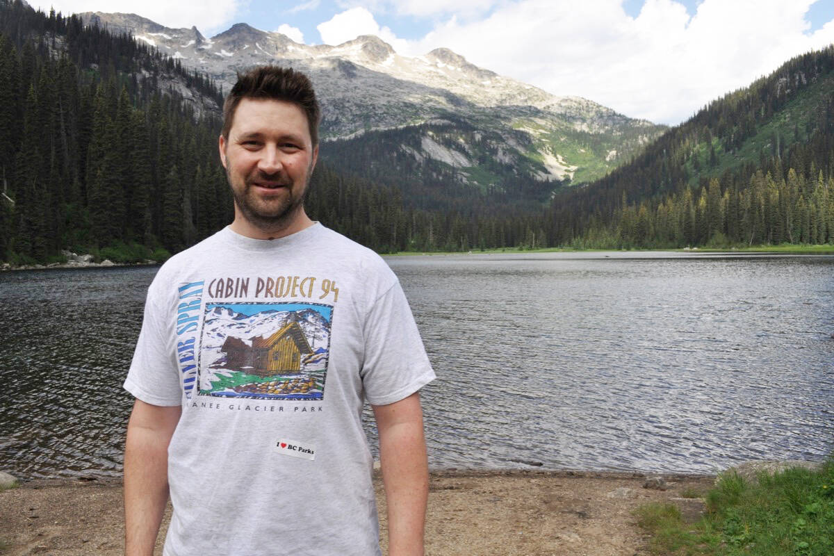 Jordan Carter stands near Gibson Lake in Kokanee Glacier Provincial Park. Carter volunteers with Friends of West Kootenay Parks and grew up at the provincial park where his father John was a ranger. Photo: Tyler Harper