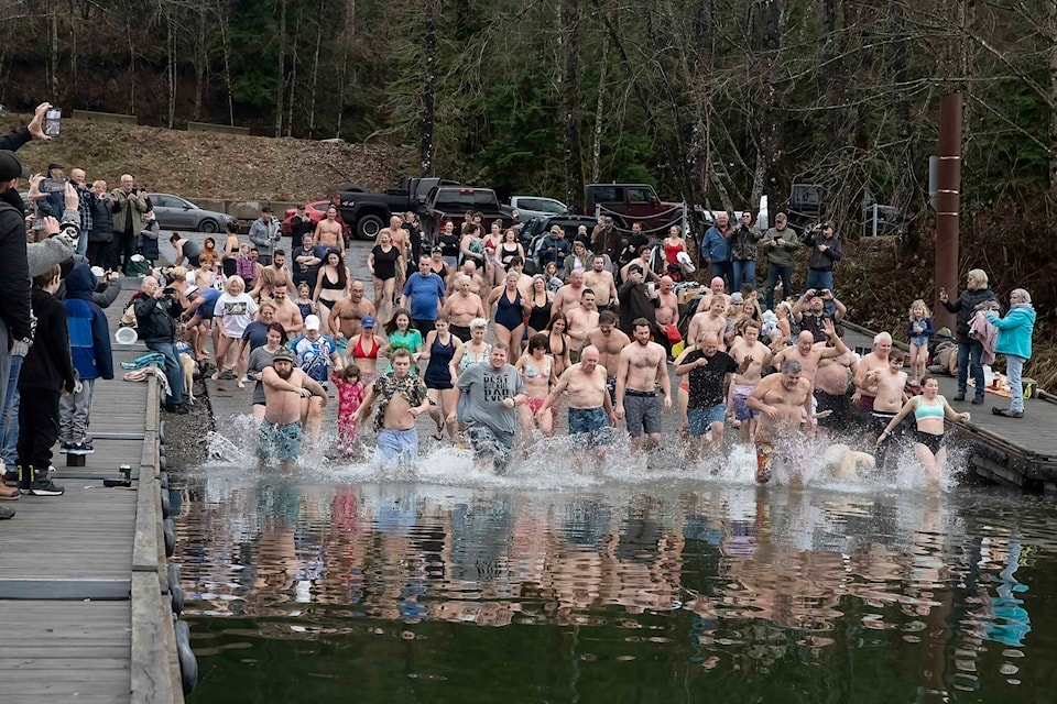 Seventy-five people dove into the new year with the 2023 Polar Bear Swim at Stave Lake. (Jan. 1, 2023) /Bob Friesen Photo