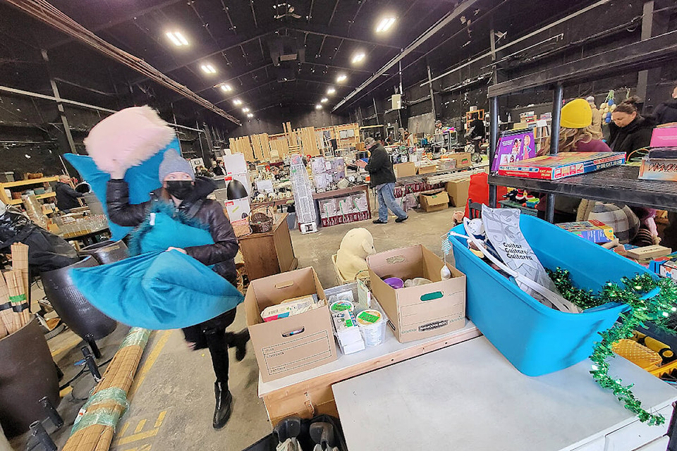 A buyer headed for the checkout at the movie set sale held in Lumiere Film Studios in Langley on Saturday, Feb. 11. (Dan Ferguson/Langley Advance Times)