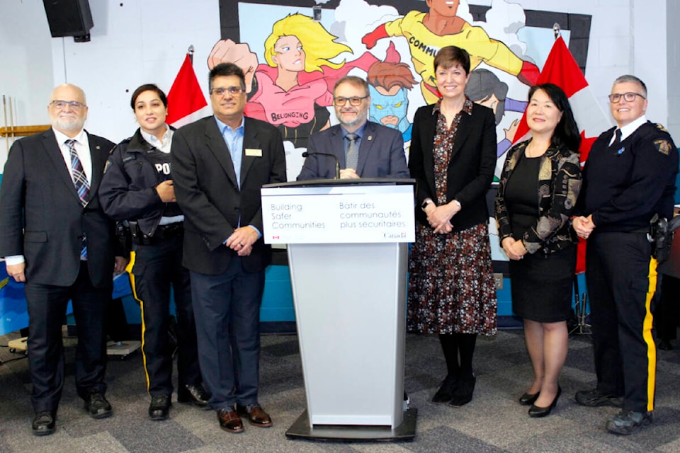(L-R) Coquitlam-Port Coquitlam MP Ron McKinnon, Ridge Meadows RCMP Supt. Wendy Mehat, Mission acting Mayor Ken Herar, Maple Ridge Mayor Dan Ruimy, parliamentary secretary to the Minister of Public Safety Pam Damoff, School District 42 chairperson Elaine Yamamoto, and assistant commissioner and Lower Mainland district commander Maureen Levy all helped announce nearly $4.7 million in funding for Fraser Valley communities. (Brandon Tucker/The News)