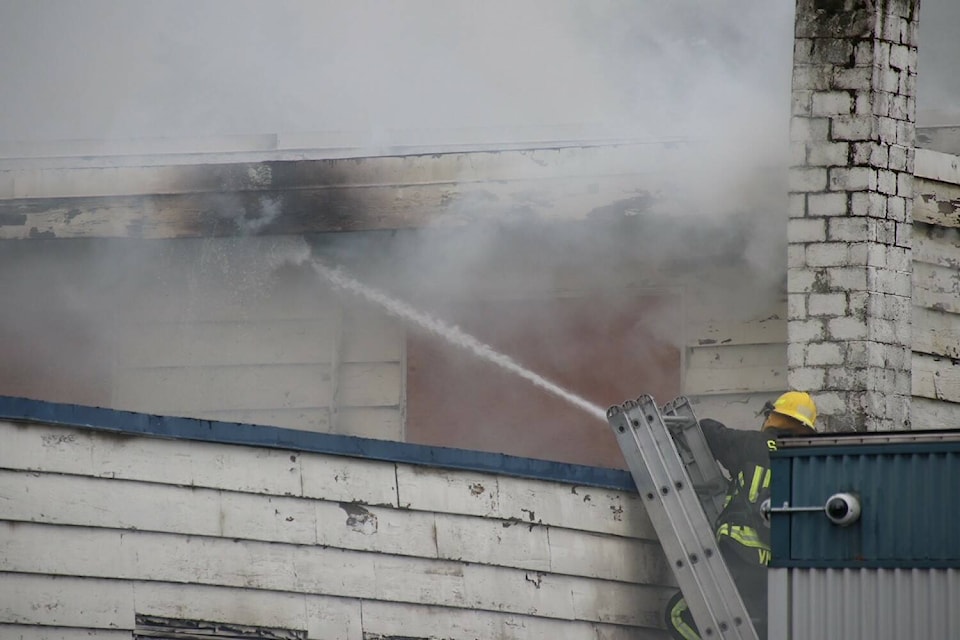 Roughly 22 Surrey firefighters battled a blaze with heavy smoke and flames in a vacant building in Whalley Sunday afternoon. (Shane MacKichan photo)
