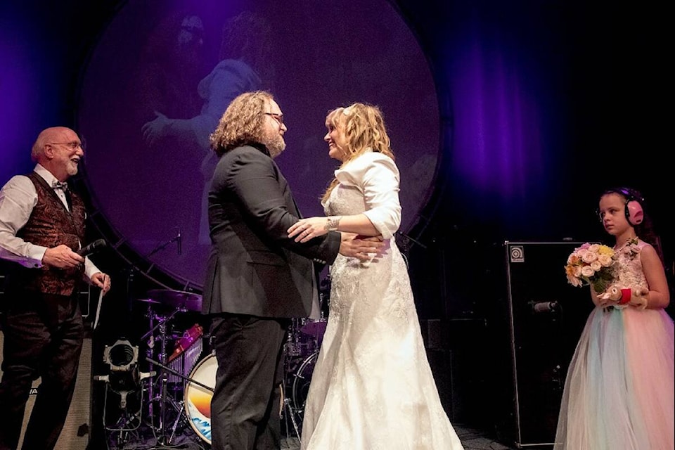 PIGS vocalist and guitarist Josh Szczepanowski and vocalist and tambourinist Charlene Szczepanowski, aka Anneda, get married on April 21 during their show at the Royal Theatre. (Courtesy John Carlow of Finding Charlotte Photography)