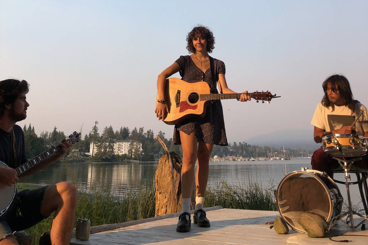 Ella Slaughter performing outdoors at an open mic. (Courtesy Ella Slaughter)