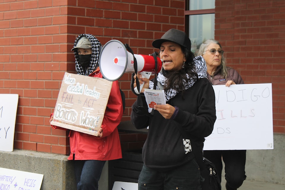 Chantey Dayal speaks outside the Nanaimo Chapters, urging shoppers to support other bookstores instead.