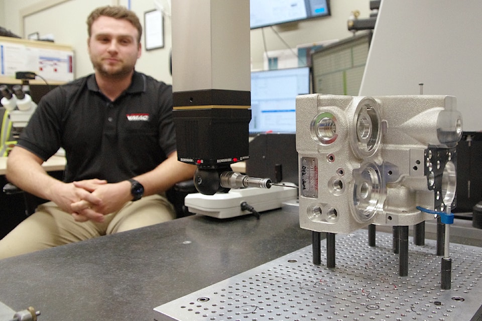 Michael Nusial, quality technician, operates a coordinate measuring machine capable of measuring tolerances of components down to .000254 millimetres.