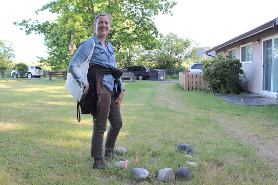 Linda Brooymans, NALT's stewardship manager stands beside one of the marked turtle nests from last year where the babies have yet to emerge.