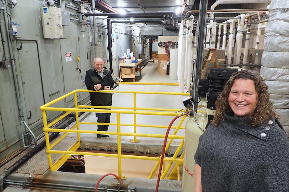 Jennifer McAskill, city manager of facility asset planning, and Mike Bryson, deputy director of civic facilities, will oversee Nanaimo Aquatic Centre's water heating and HVAC equipment retrofit that could cut GHG emissions by 800 tonnes annually. (Chris Bush/News Bulletin)