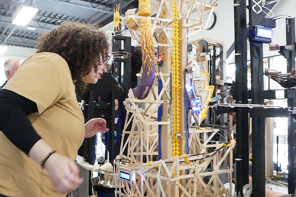 Zeina Al-Jawasneh checks on a section of the NRG Machine, one of nine VIU engineering student creations involved in a demonstration of physics and engineering concepts at Vancouver Island University Friday, April 11.
(Chris Bush/ News Bulletin)