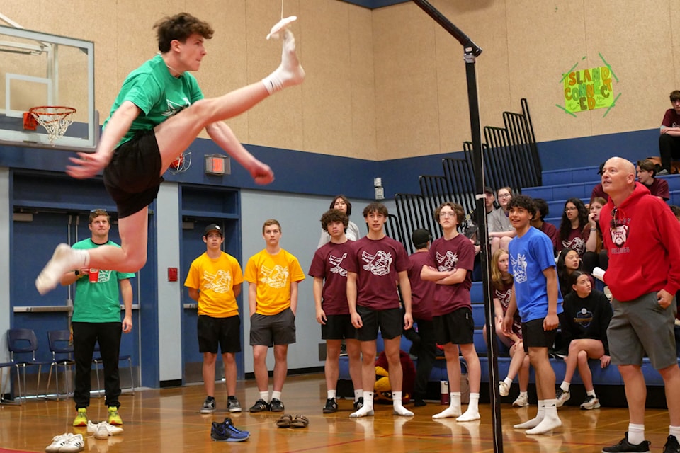 Nanaimo District Secondary School student Nathan Antonchuk gains some altitude in the high kick competition. (Chris Bush/News Bulletin)