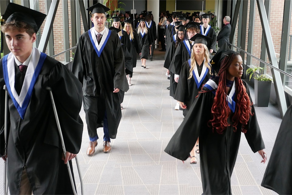 Dover Bay Secondary School students make their way to their graduation ceremony in the Vancouver Island Conference Centre. (Chris Bush/News Bulletin)