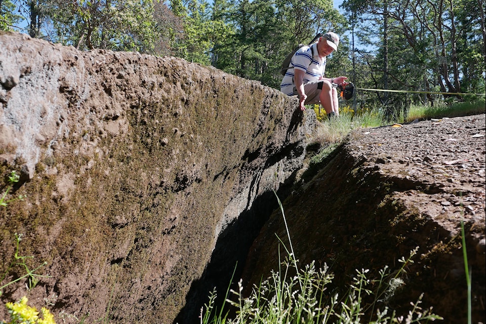 Tim Stokes, a Vancouver Island University’s Earth sciences professor, shares ideas about some of the forces that might have been at play in the Abyss might have played their parts in creating the Abyss. (Chris Bush/News Bulletin)