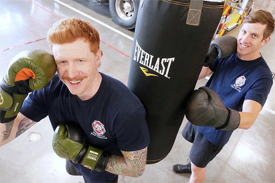 Nanaimo Fire Rescue firefighters Dane Cameron, left, and Layne Polnick are getting in the ring to raise money for Wounded Warriors Canada with the return of the Harbour City Badge Battle at the Vancouver Island Conference Centre on Aug. 9. (Chris Bush/News Bulletin)