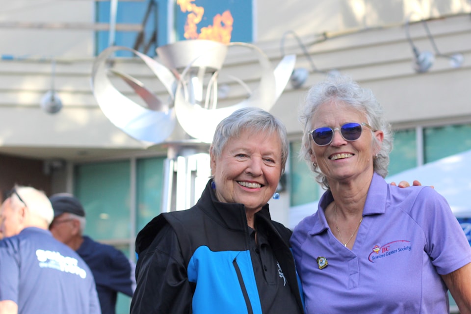 Diana Johnstone, president of the Nanaimo 55-Plus B.C. Games host society, and Diane Murphy, president of the B.C. Seniors Games Society, celebrate the start of the 100-day countdown to this year's B.C. 55-Plus Games in Nanaimo at a ceremony Thursday, June 19, at Diana Krall Plaza. (Greg Sakaki/News Bulletin)