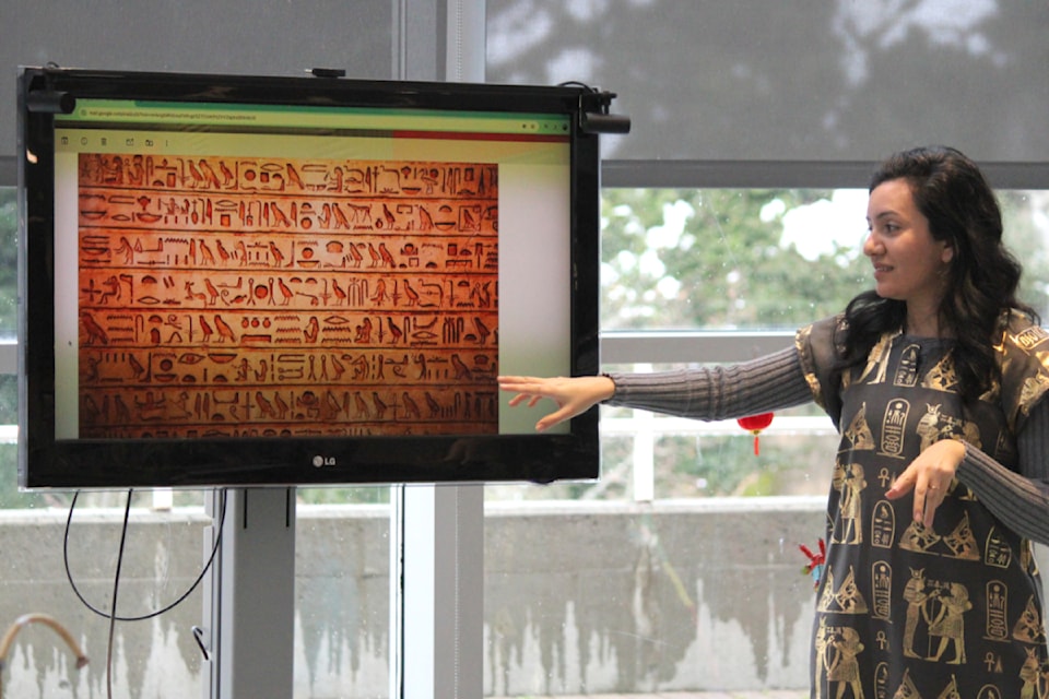 Lydia Yacoub tells the audience at Nanaimo Harbourfront Library about hieroglyphics on Feb. 8. (Karl Yu/News Bulletin)